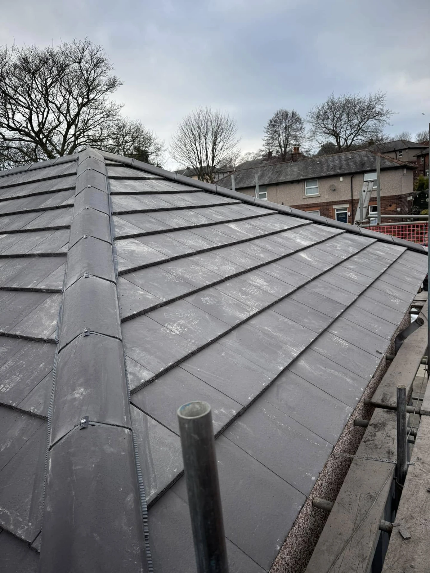 High-angle view of a roof hip with dark grey ridge capping