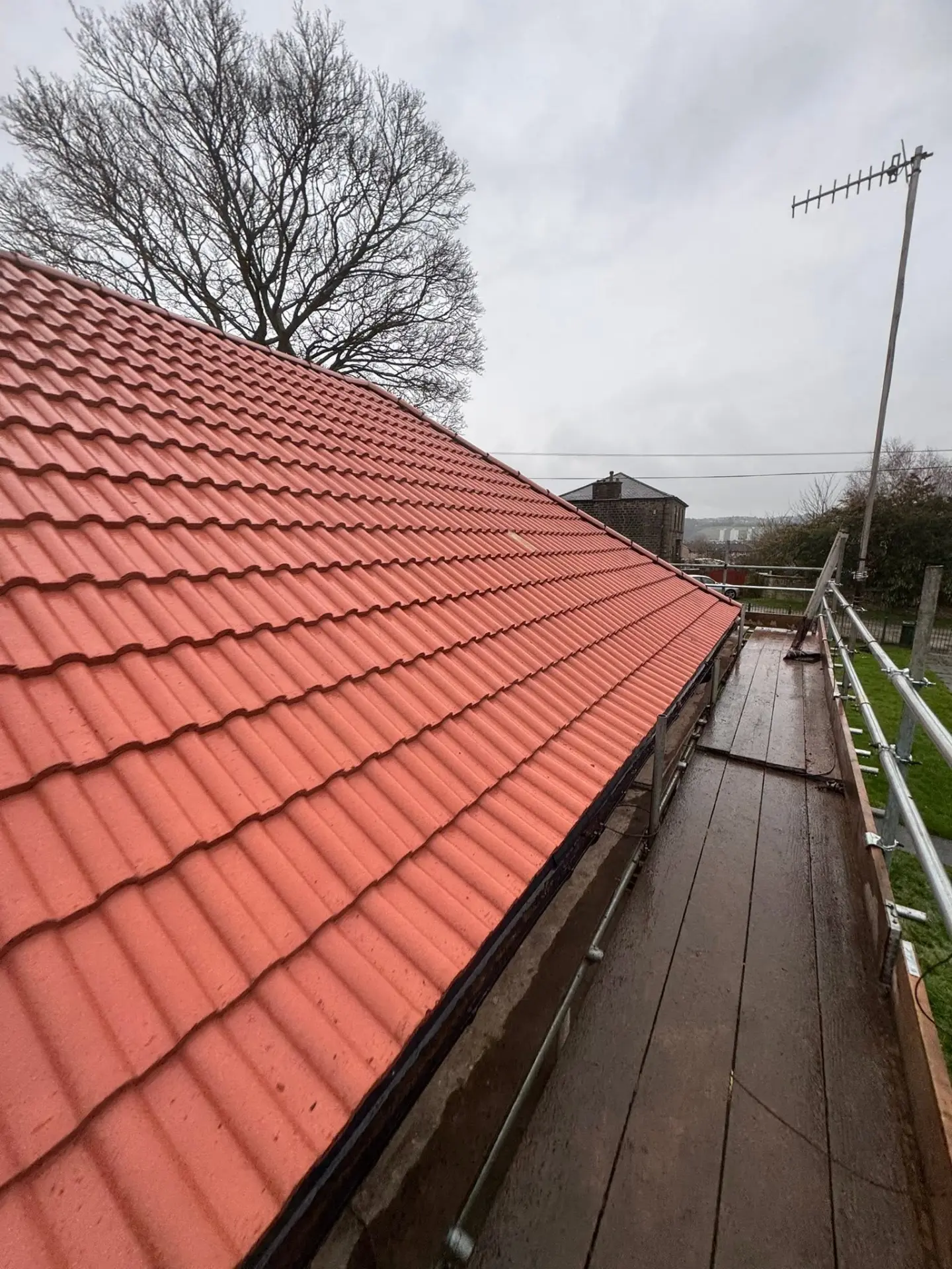 Finished red pantile roof covering