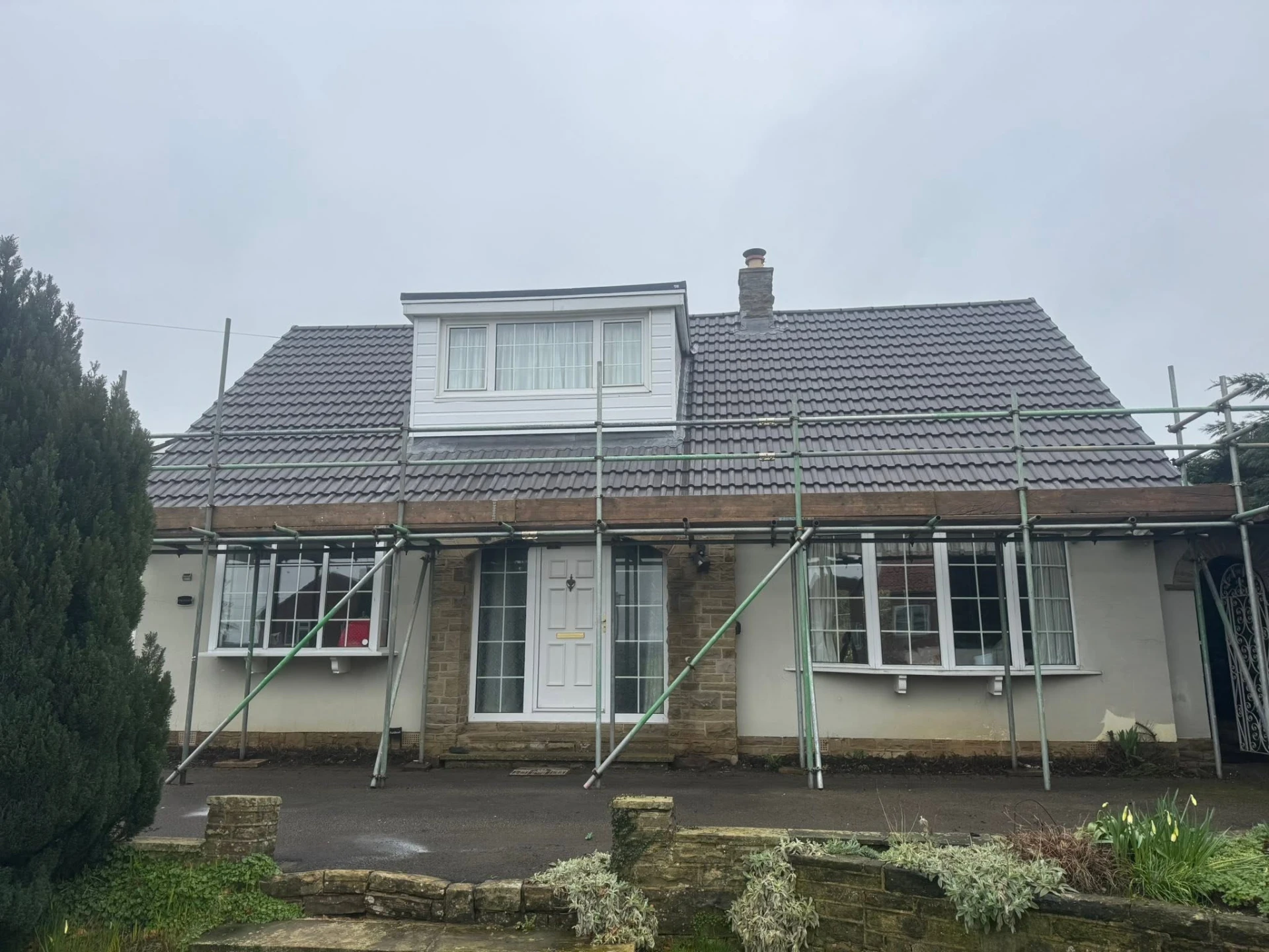 Bungalow with a newly completed tiled roof